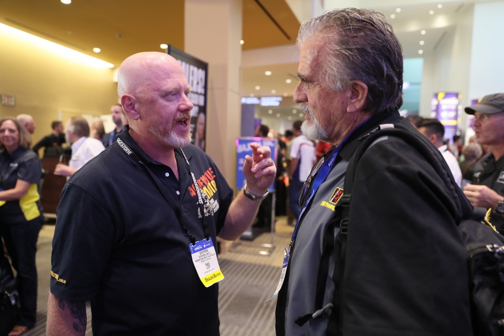AIMExpo Dealer Attendees Engaged in Conversation